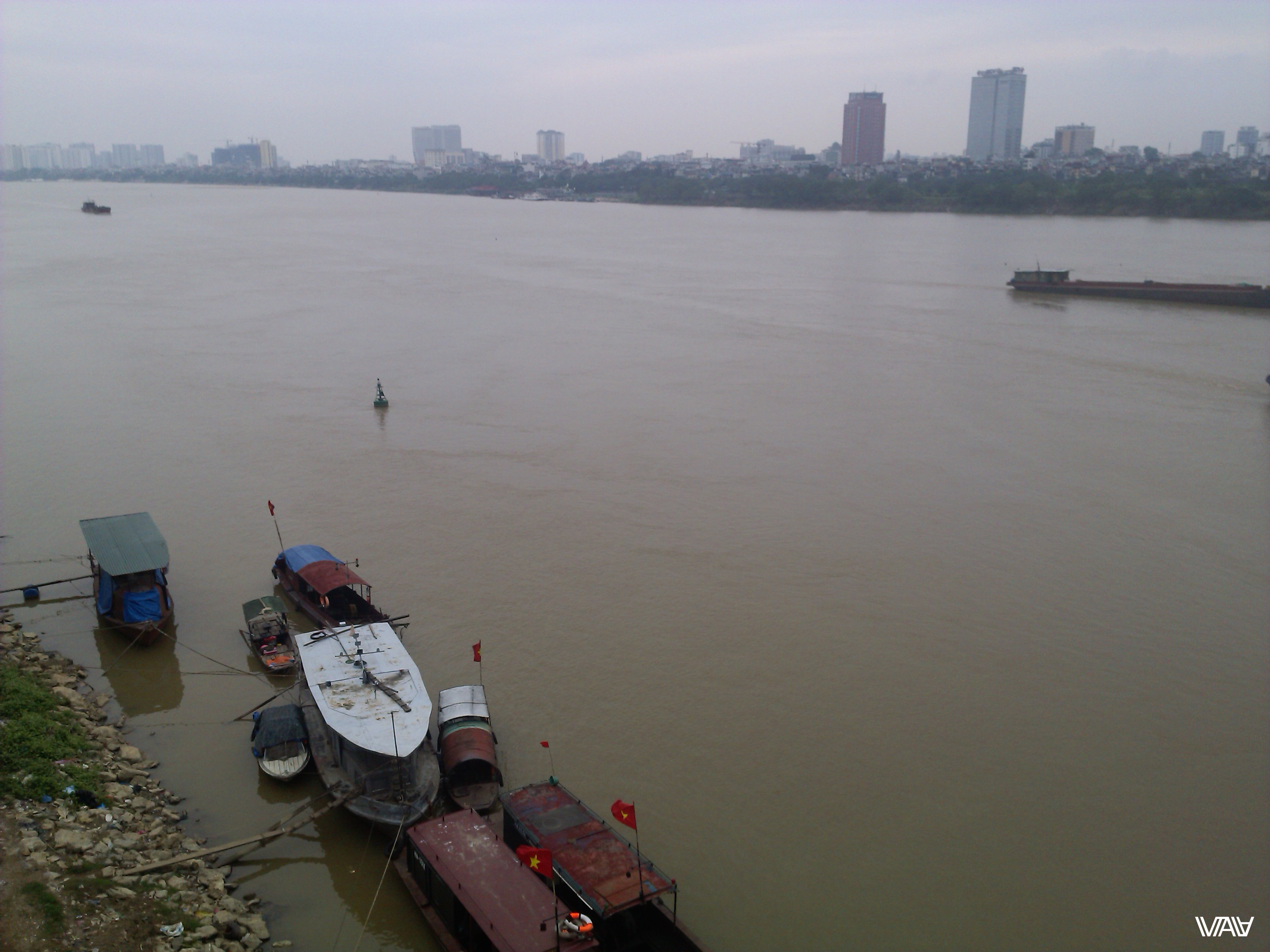 Incredibly but this river is called Red. That is a completely different color in reality. Hanoi, Vietnam